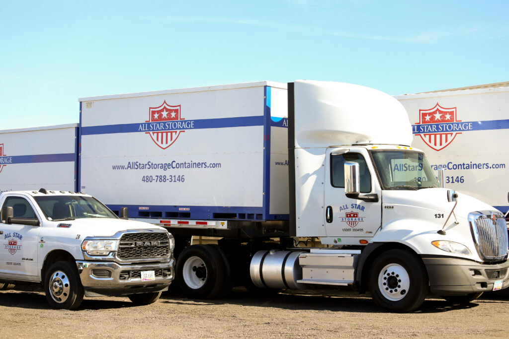 Image of Semi truck and Dodge Ram Truck with trailers and shipping containers ready for delivery