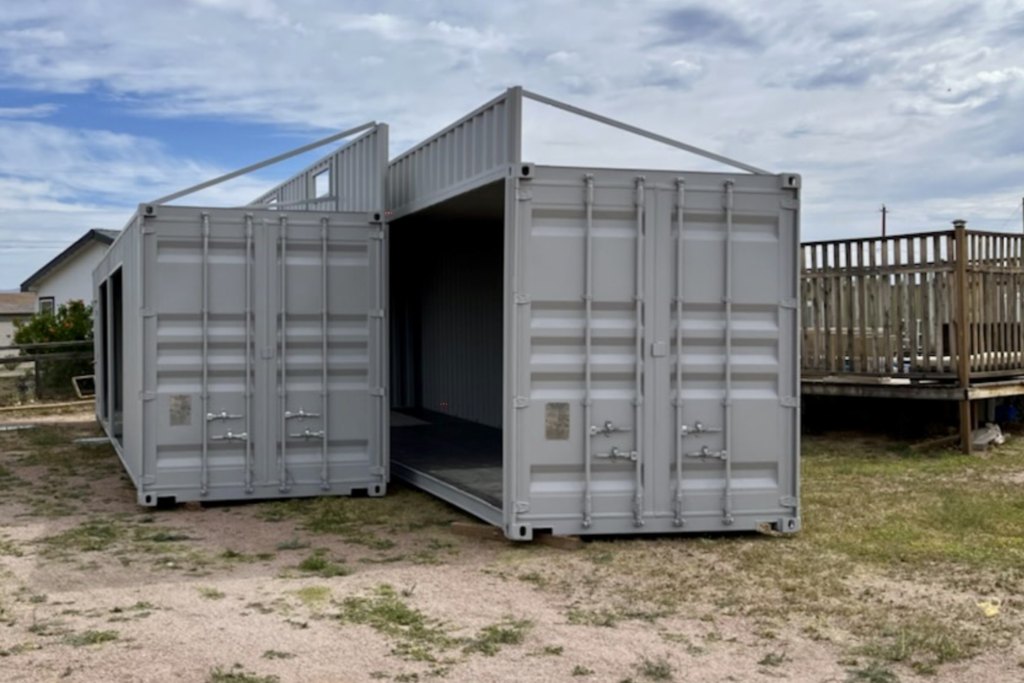 2 20ft Modified Shipping Containers with wall cut and raised platform