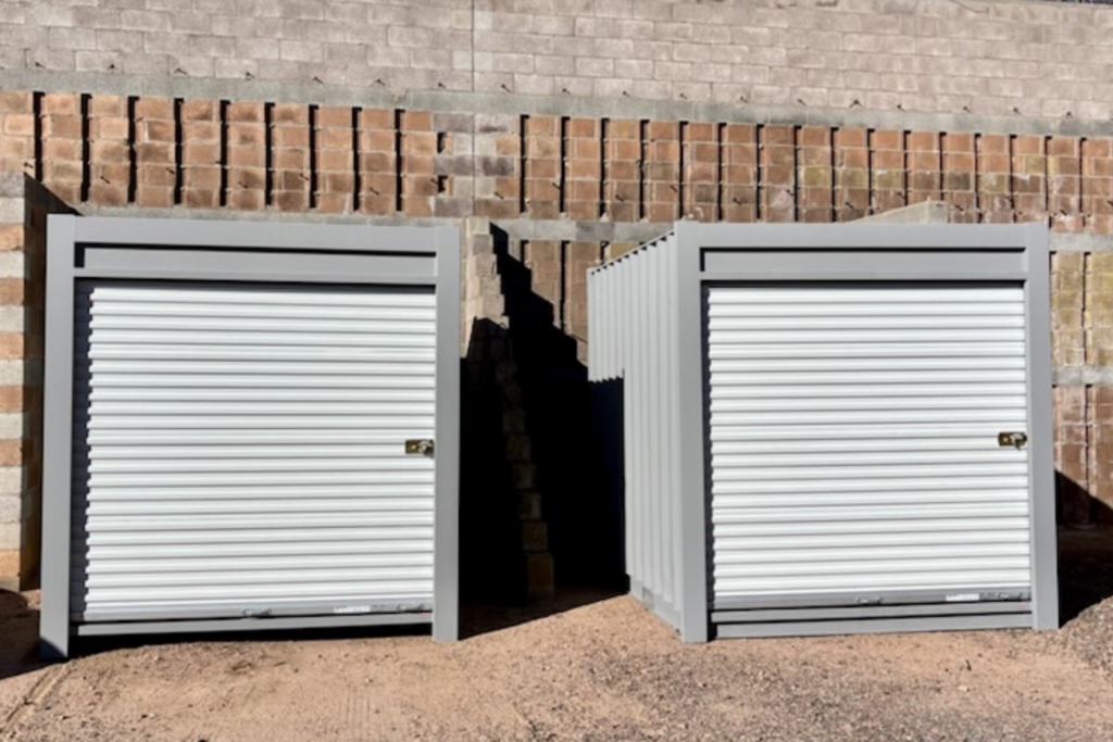 2 20ft Grey Modified Shipping Containers with white end roll up doors