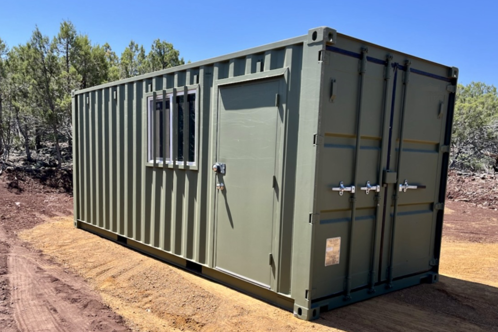 20ft Modified Shipping Container with custom paint, window with bars, walk door with drip edge