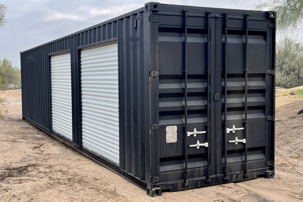 40ft Modified Shipping Container painted black with 2 side roll up doors